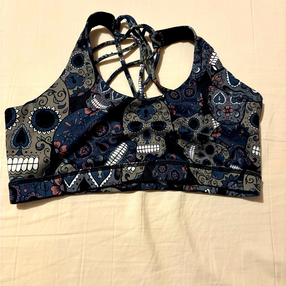 Constantly varied gear bra.  Midnight skulls. Size large. Butterfly back. CVG